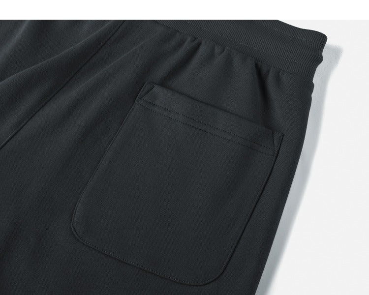Unisex fit demonstration drawstring sweat shorts gender-neutral design inclusive sizing versatile styling all body types wear