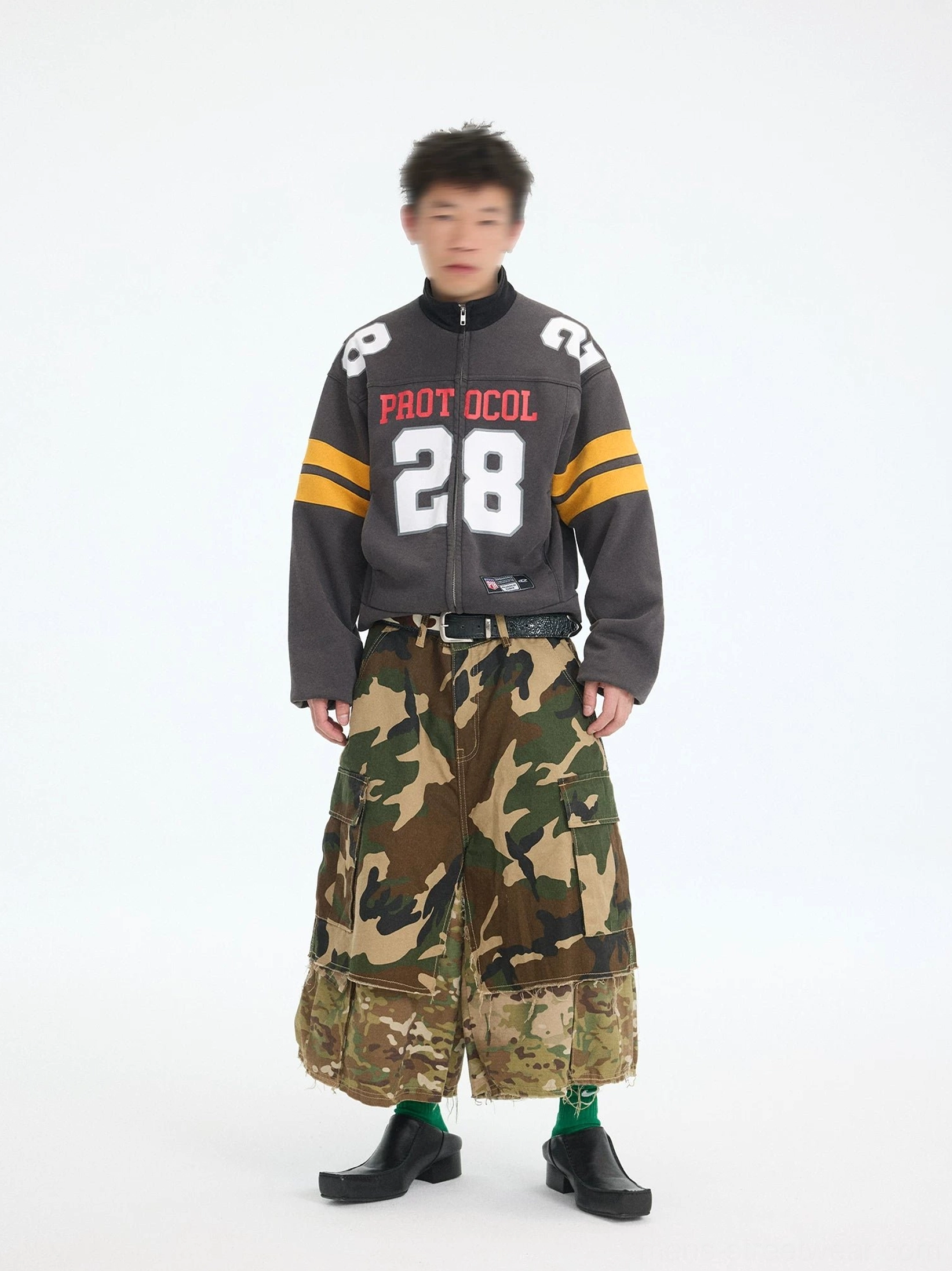 Charcoal gray cropped football zip jacket with Protocol 28 chest graphic and yellow sleeve stripes front full body streetwear outfit