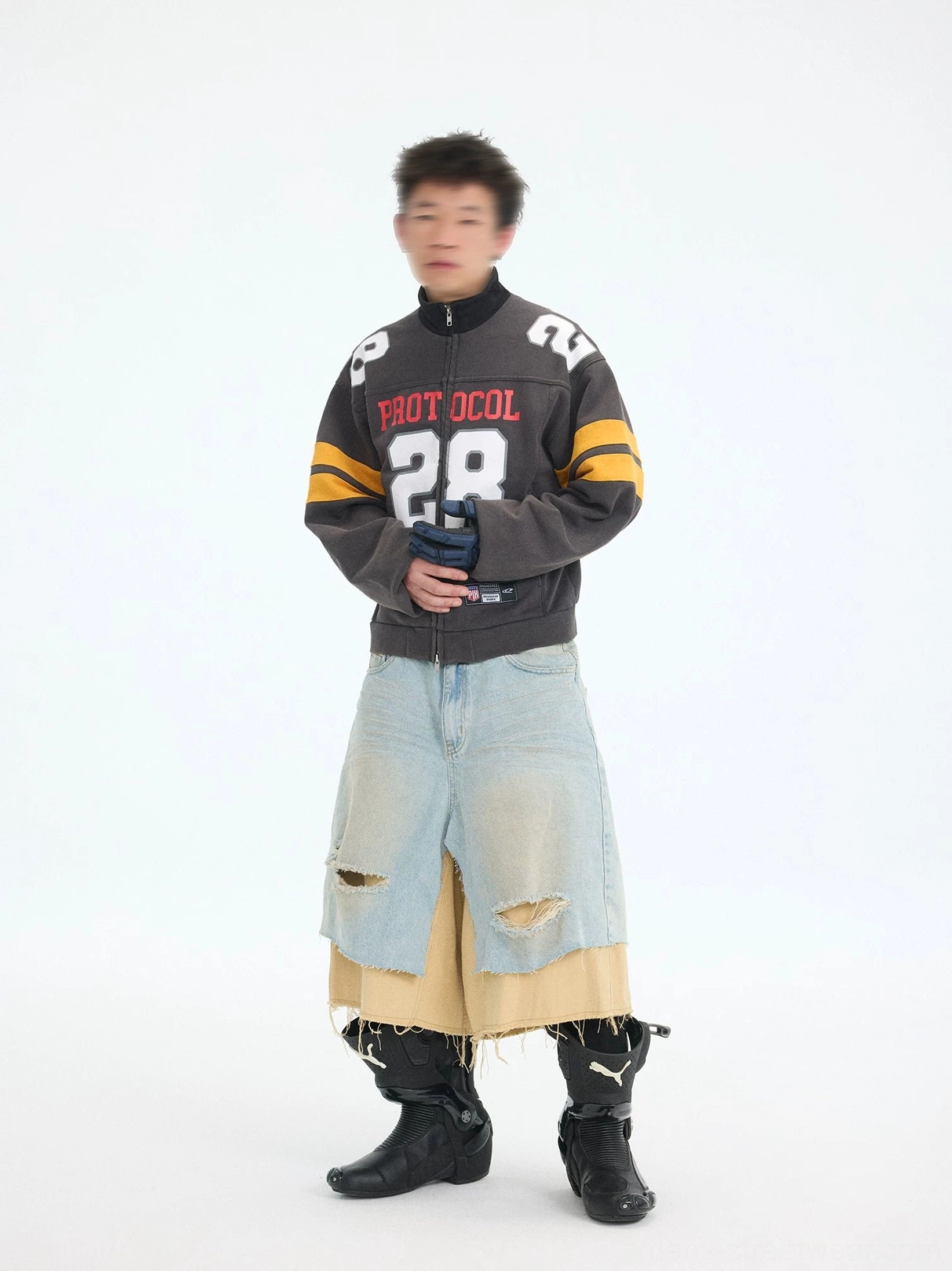 Close front view of charcoal cropped football zip jacket with red Protocol lettering white number 28 and mock neck collar