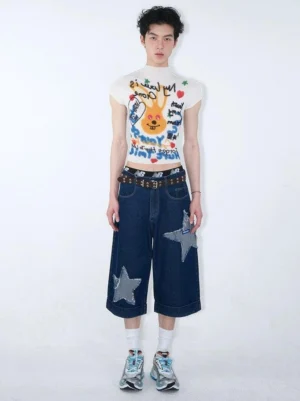 Male model wearing a white abstract graffiti rabbit cropped mock neck T-shirt with wide-leg denim pants and studded belt in a Seoul streetwear outfit