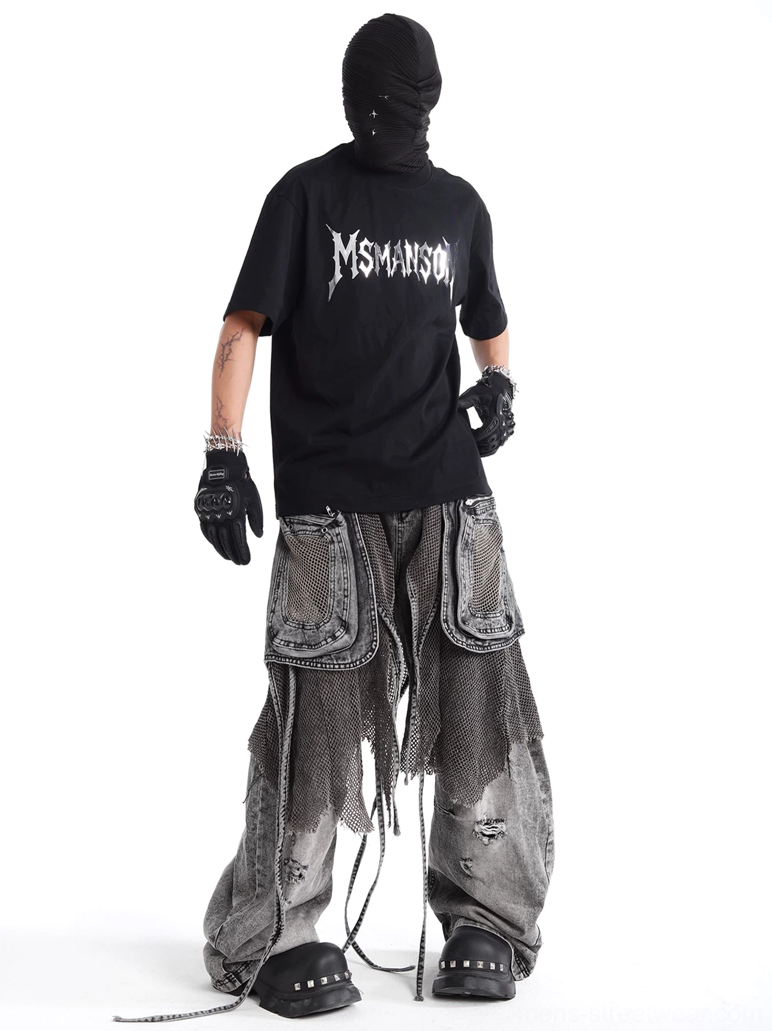 Back full-body streetwear outfit showing charcoal ash distressed mesh layered cargo jeans with wide-leg denim silhouette and rear panel detailing