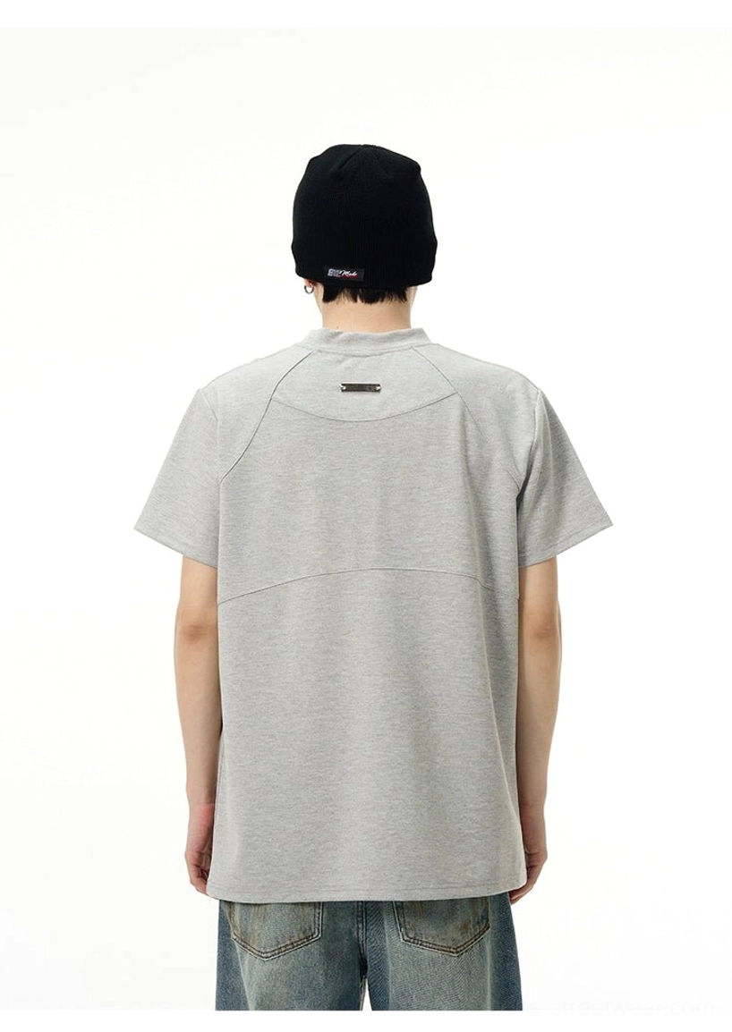 Back view of relaxed heather grey Acid Techno tee showing panel seams and a small upper back garment tag