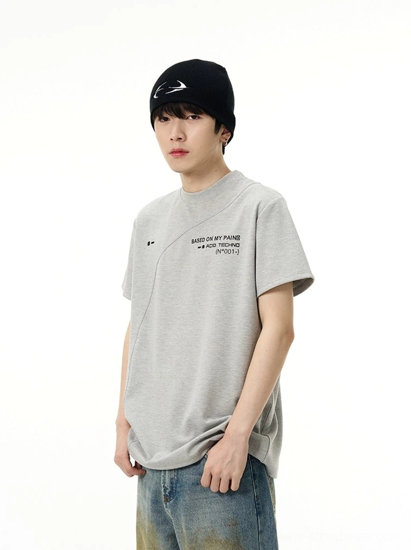 Heather grey Acid Techno graphic T-shirt with relaxed fit, diagonal panel seam, crew neckline, and vintage washed jeans