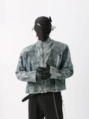 Acid-wash blue gray textured denim moto jacket front view with stand collar and zip closure