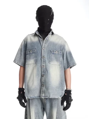 Front close-up of acid-washed vintage blue denim camp shirt with short sleeves, dual chest pockets, button front, point collar, and relaxed Korean streetwear fit