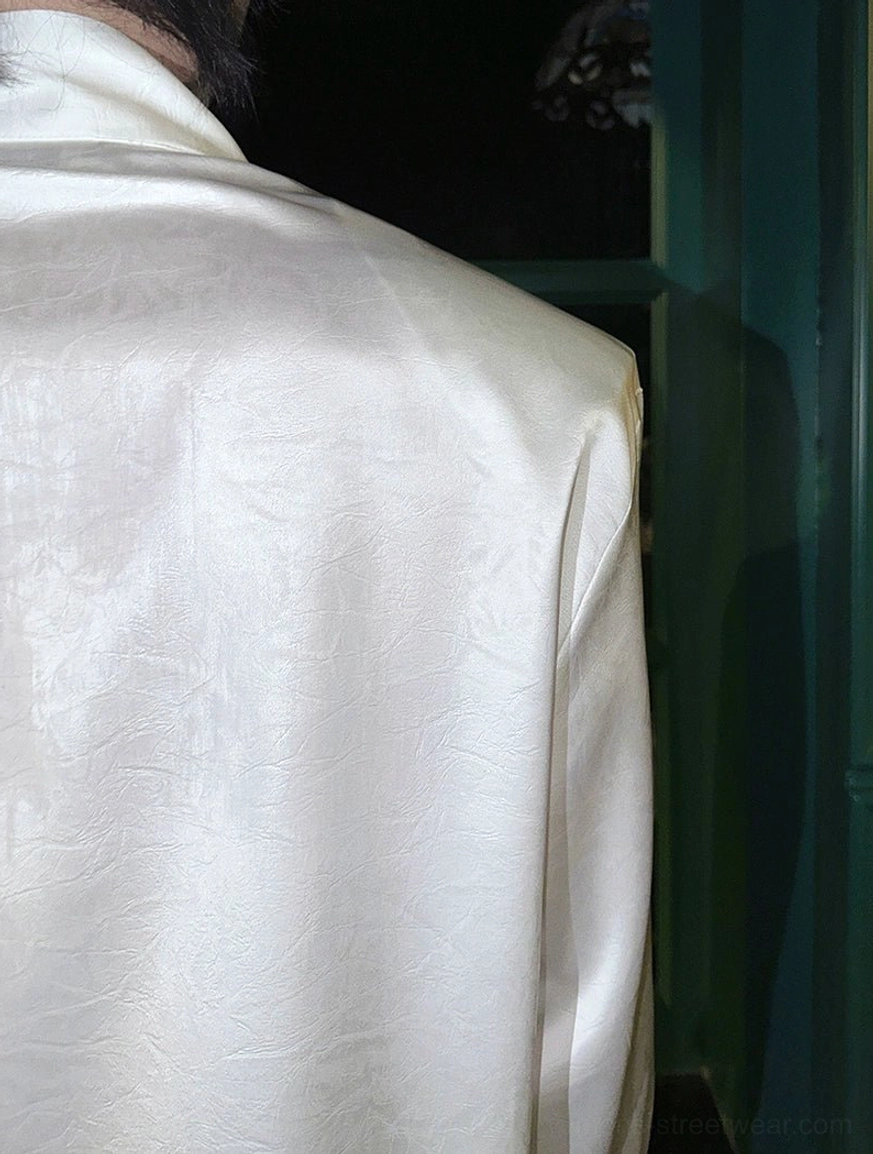 Acubi-inspired glossy tie-neck streetwear shirt with fluid finish and dramatic contemporary silhouette