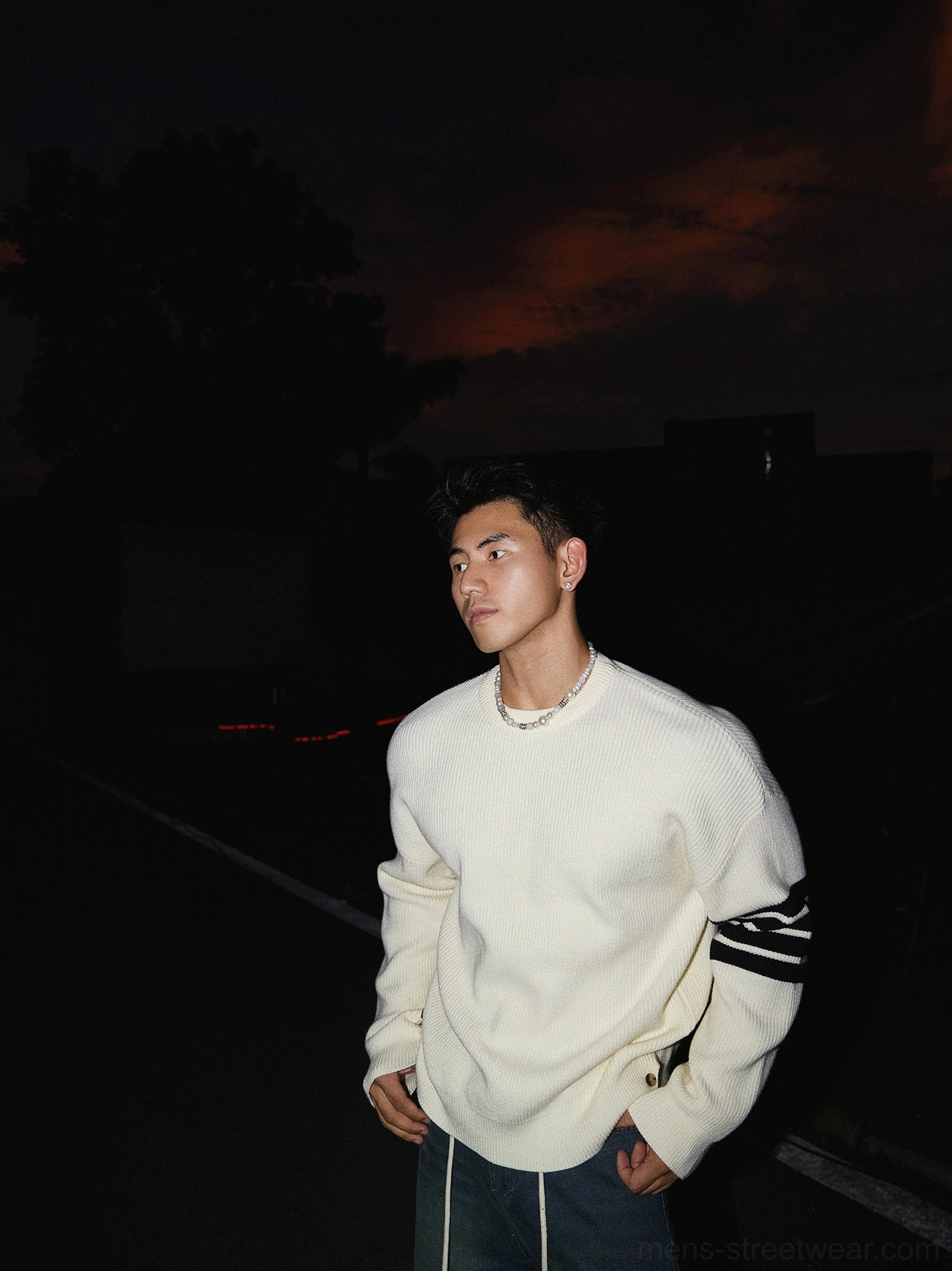 Acubi-inspired striped sleeve crewneck knit sweater with loose streetwear proportions, textured ribbed finish, and understated urban details