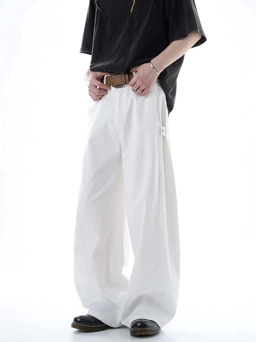 White Acubi ultra wide-leg cargo pants shown on a male model in a front full-body studio view with flowy wide legs, high-waisted styling, brown belt detail, and a side cargo pocket