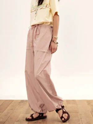 Lotus pink wide-leg cargo pants with drawstring waist and large 3D pockets front outfit view