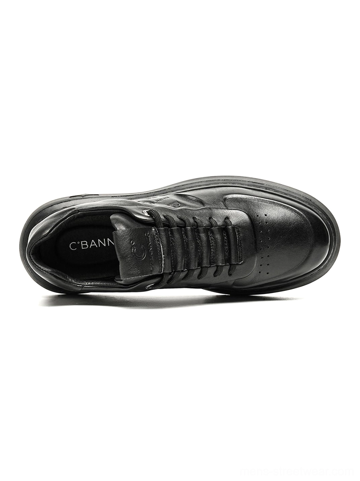 All-black embossed low-top platform sneakers with tonal laces and textured panels for Seoul-inspired casual styling