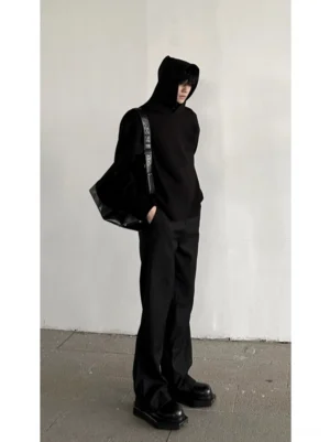 All black flared trousers styled with a hooded sweatshirt and platform loafers in a modern Korean streetwear outfit