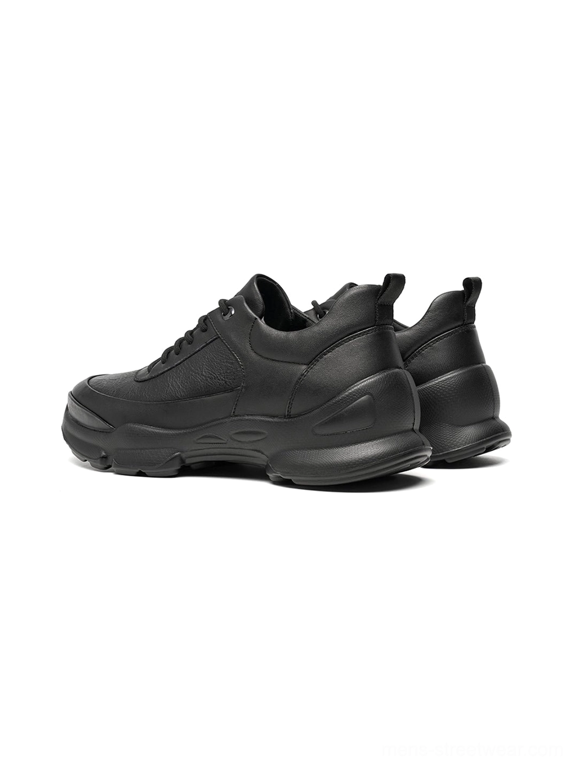 All-black low-top chunky sneakers with layered panels and a contemporary sculpted athletic outsole