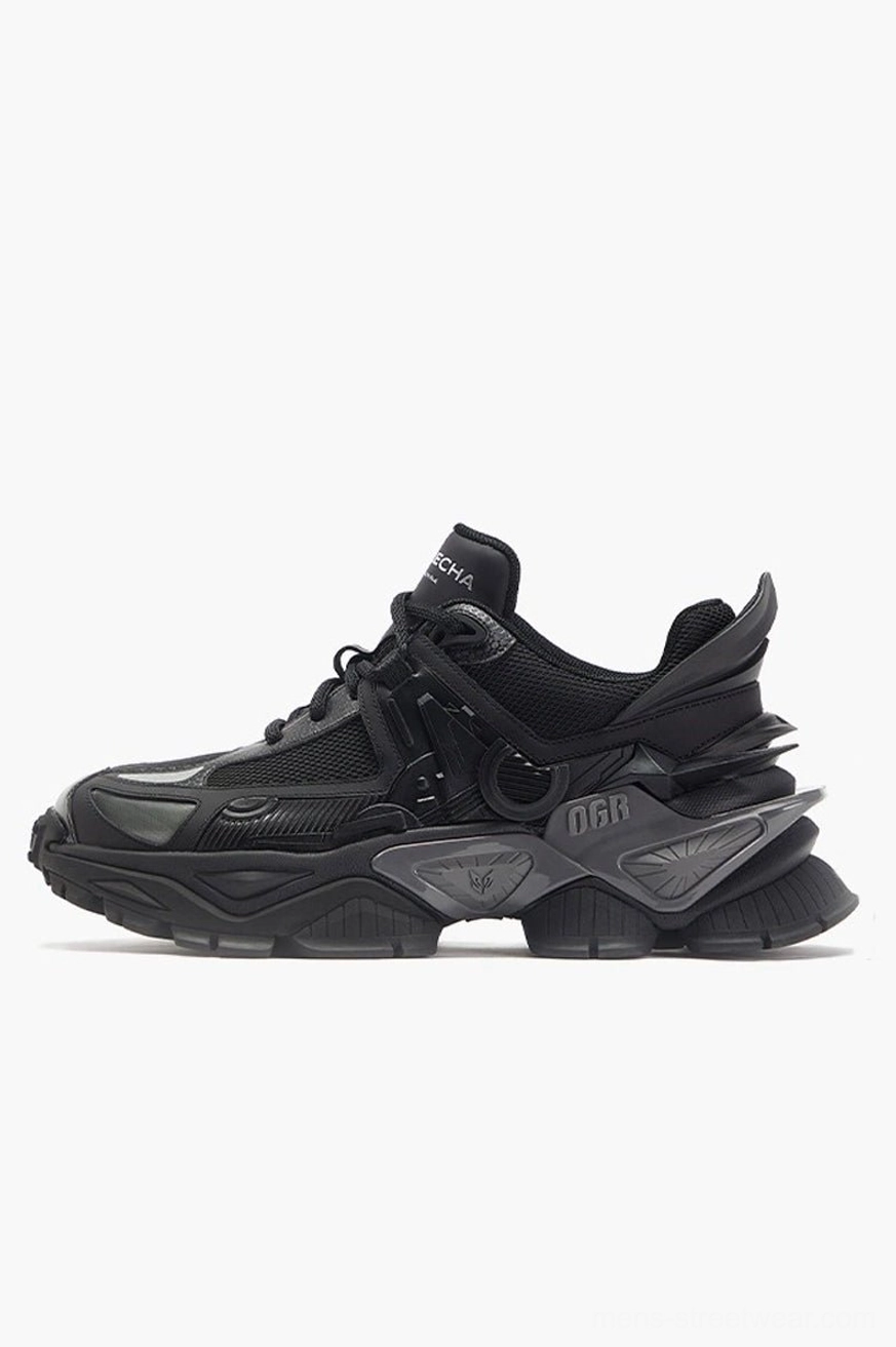 All-black mecha platform sneakers with mixed mesh and structured upper panels and a bold chunky rubber streetwear outsole