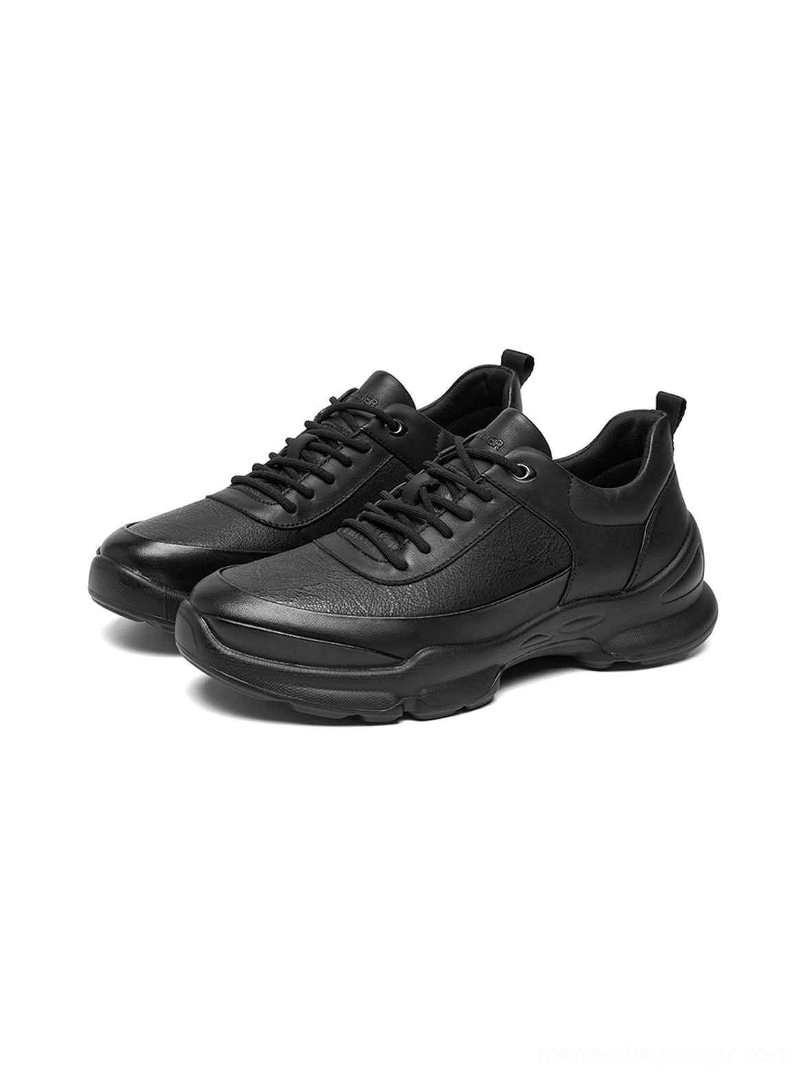 Front view of all-black sculpted sole chunky sneakers with rounded toe tonal laces and thick athletic sole