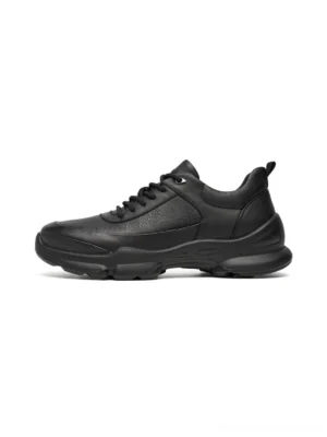 Side view of all-black sculpted sole chunky sneakers with textured leather-look upper and tonal black laces