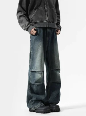Ancient blue washed carpenter baggy jeans front lower-body view highlighting the wide leg silhouette, faded denim wash, stacked knee pleats, and utility tab