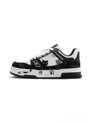 Black and white anime cat graphic low-top sneakers with paw print panels, contrast details, and thick layered streetwear sole