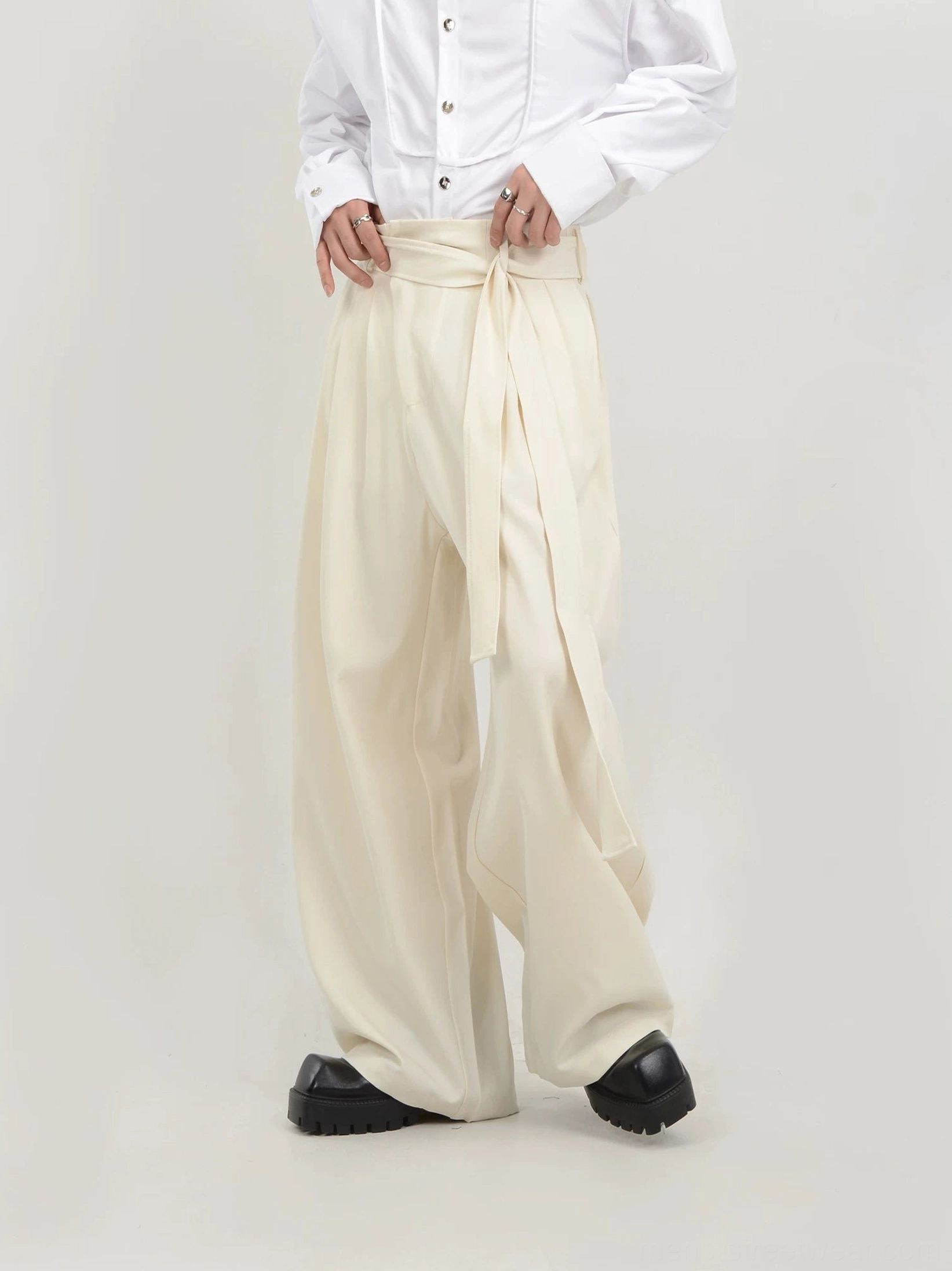 Apricot beige high-waisted wide-leg trousers for men side three-quarter view with long waist sash