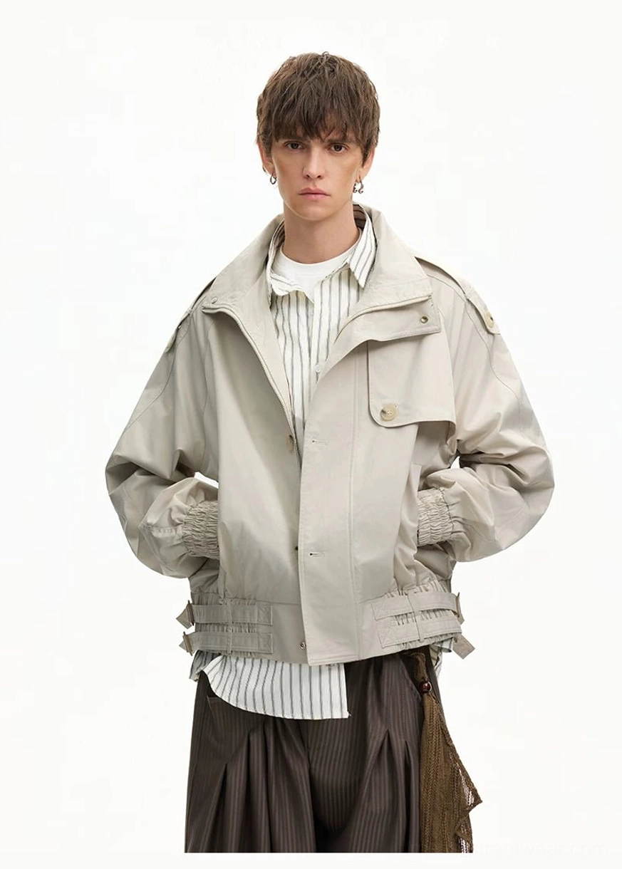 Apricot boxy loose windbreaker jacket with shoulder epaulets adjustable hem drawstrings and layered streetwear styling