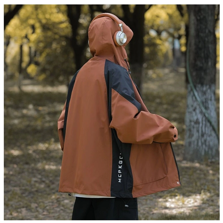 Apricot and black inspired colorblock windbreaker jacket with adjustable hood for transitional weather
