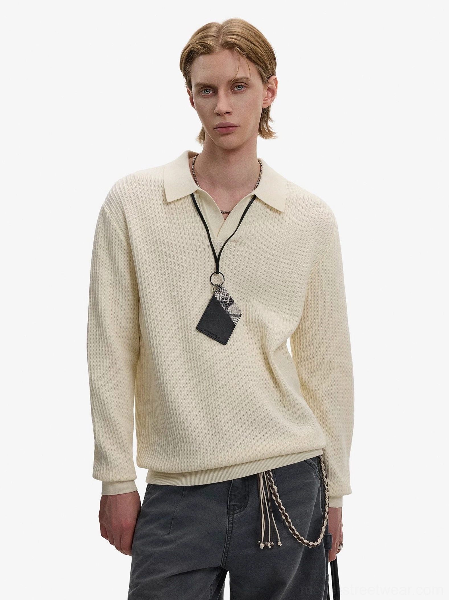Apricot cream waffle knit Johnny collar polo sweater worn with dark gray wide-leg trousers and chain necklace in Seoul streetwear style