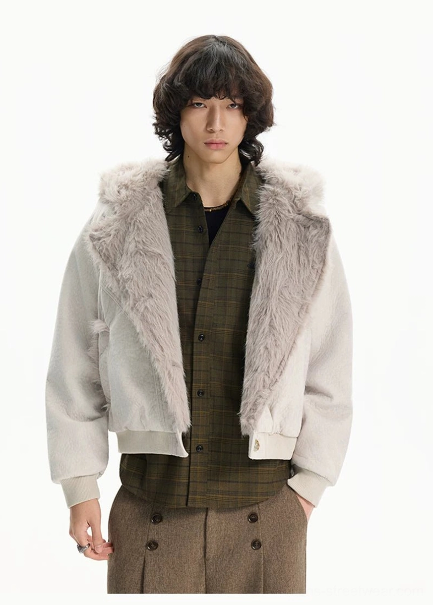 Apricot cropped faux fur lapel jacket styled with layered checkered shirt black top and brown trousers