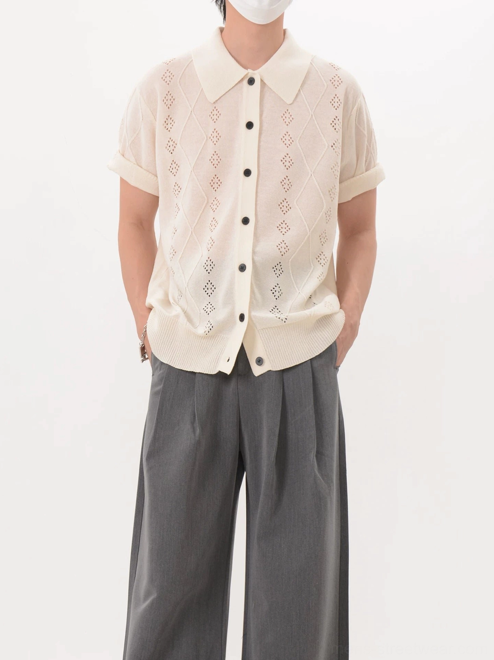 Apricot diamond lattice hollow knit polo cardigan displayed from the front with contrasting button closure