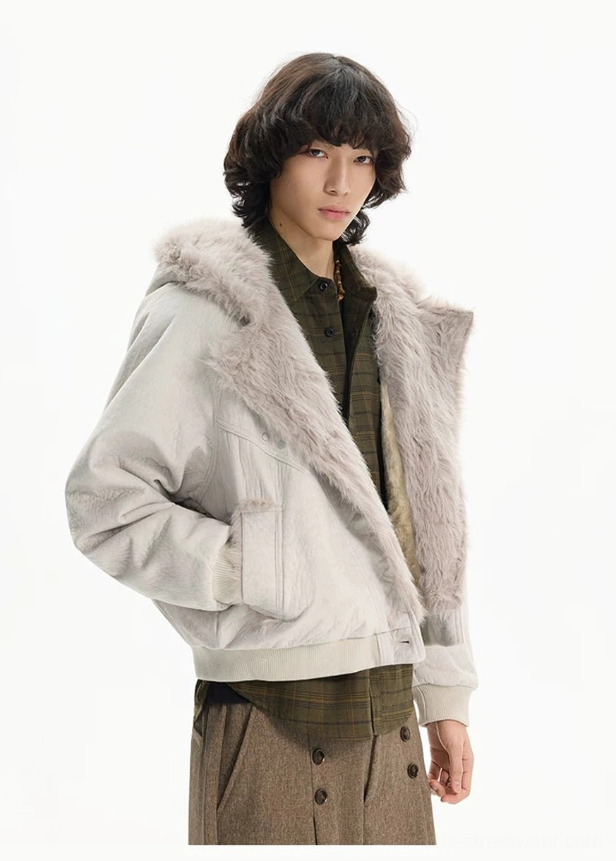 Side profile of apricot faux fur cropped bomber jacket with fluffy lapel and hand warmer pocket