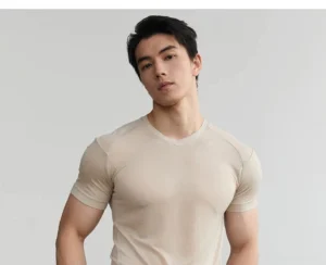 Apricot men's fitted short sleeve Lyocell T-shirt with soft V neckline and semi-sheer lightweight fabric shown in a minimalist studio portrait