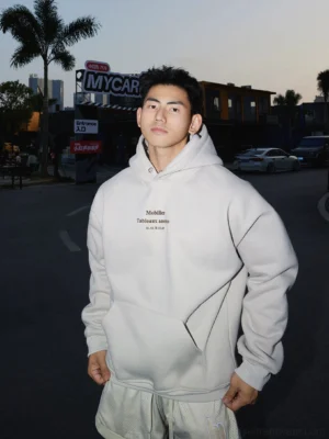Apricot minimal text graphic pullover hoodie with relaxed oversized streetwear fit and kangaroo pocket
