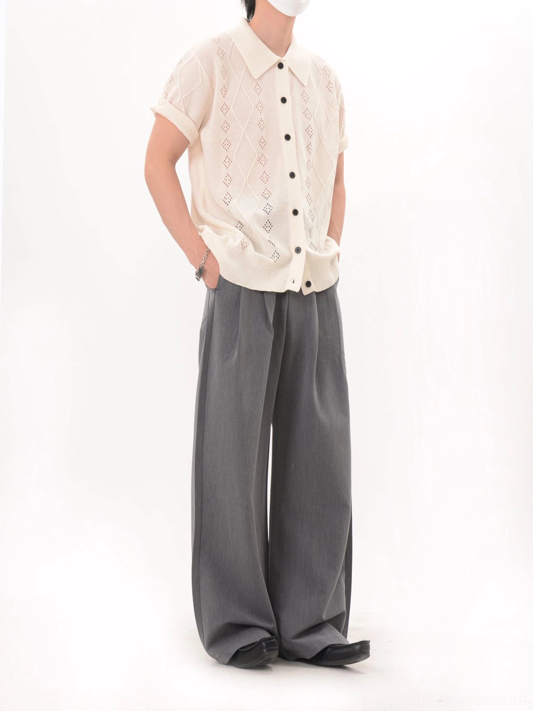 Apricot relaxed-fit openwork knit polo cardigan with diamond lattice texture shown in a side three-quarter view