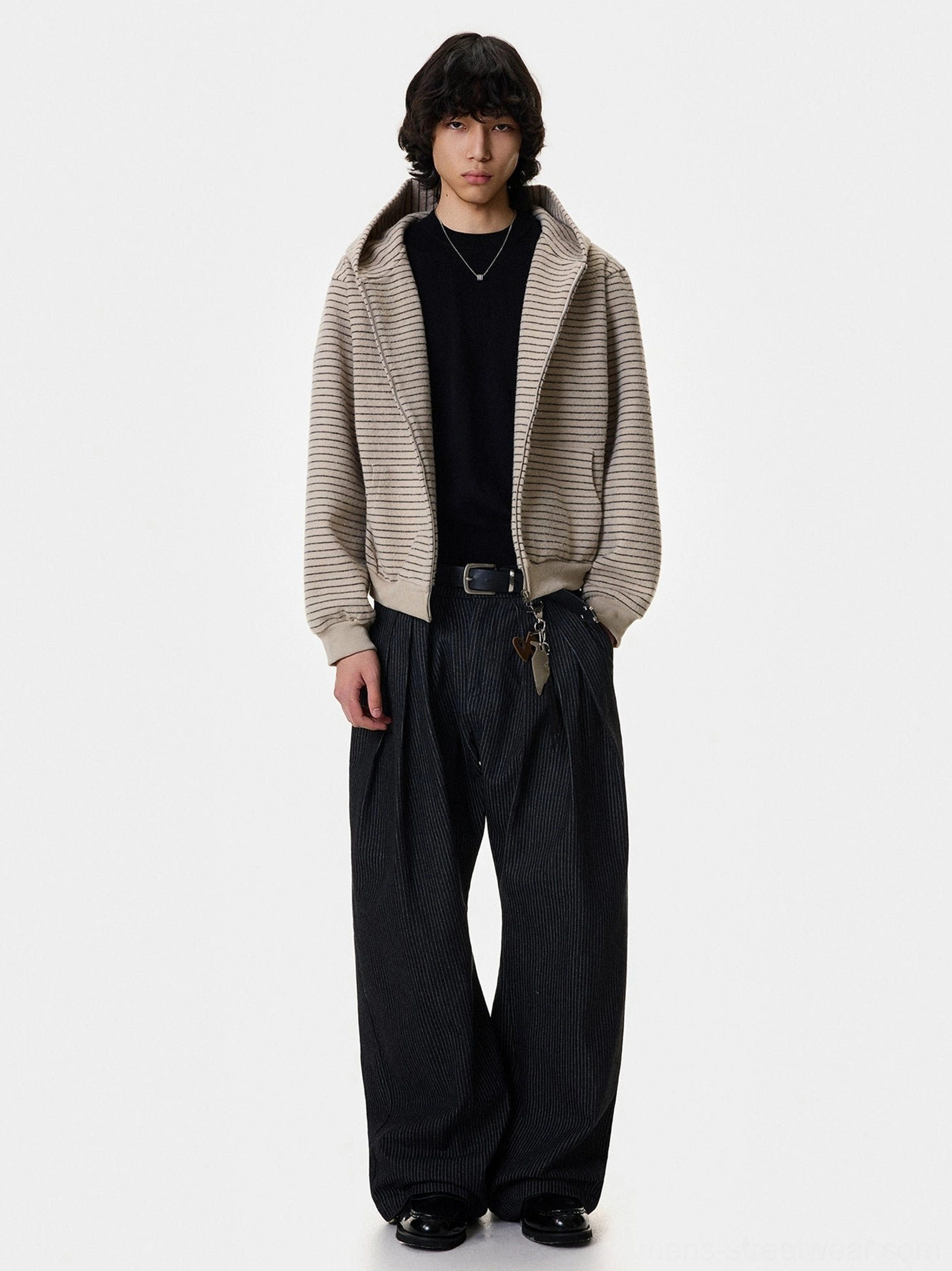 Apricot striped slouch zip hoodie with silver fox fur trim worn open over a black top with wide leg dark denim