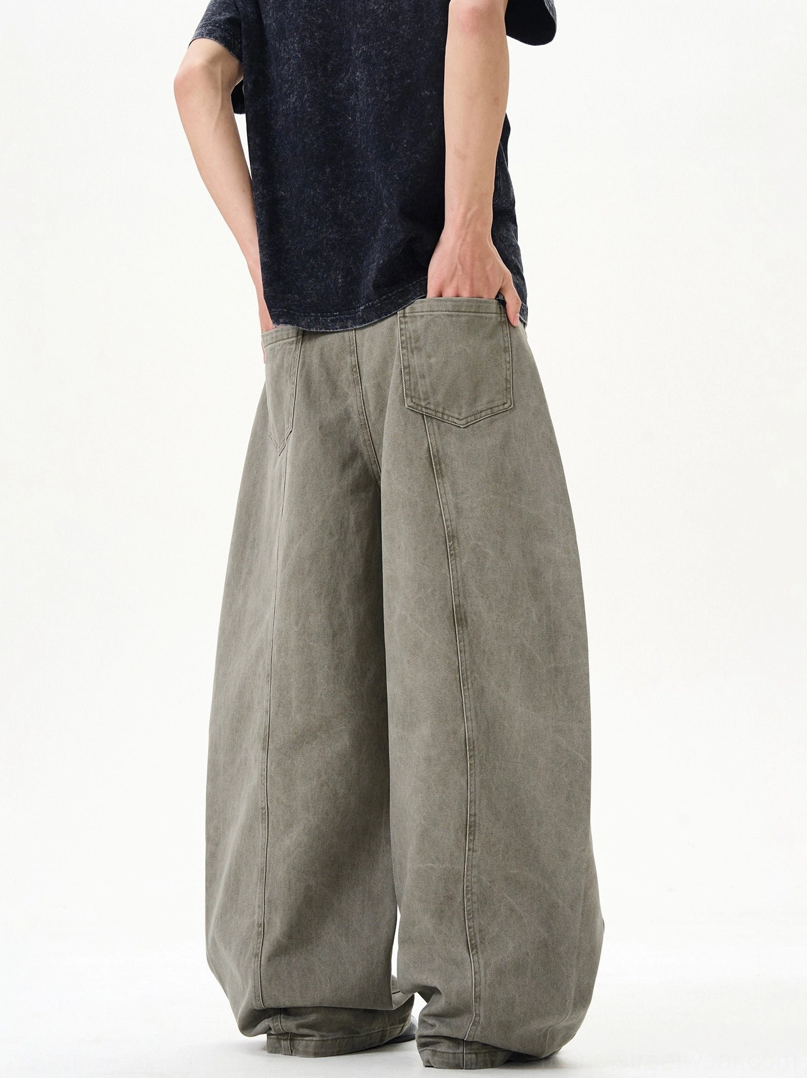 Bluish gray green ultra-wide washed denim balloon jeans back view with roomy barrel leg silhouette and rear pockets