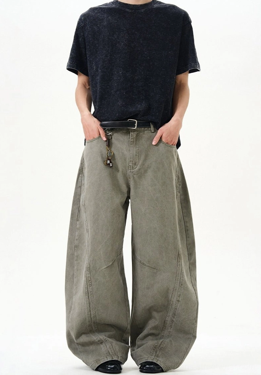 Cement ash arc seam ultra-wide balloon jeans front outfit view with faded wash and long pooling wide leg