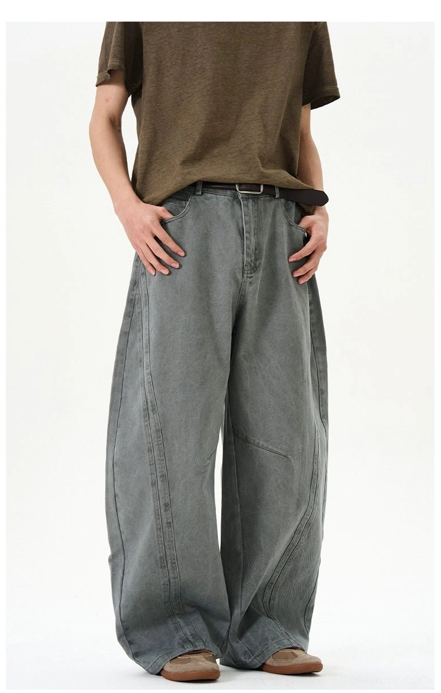 Bluish gray green ultra-wide balloon denim jeans full length front view showing sculptural arc seam design