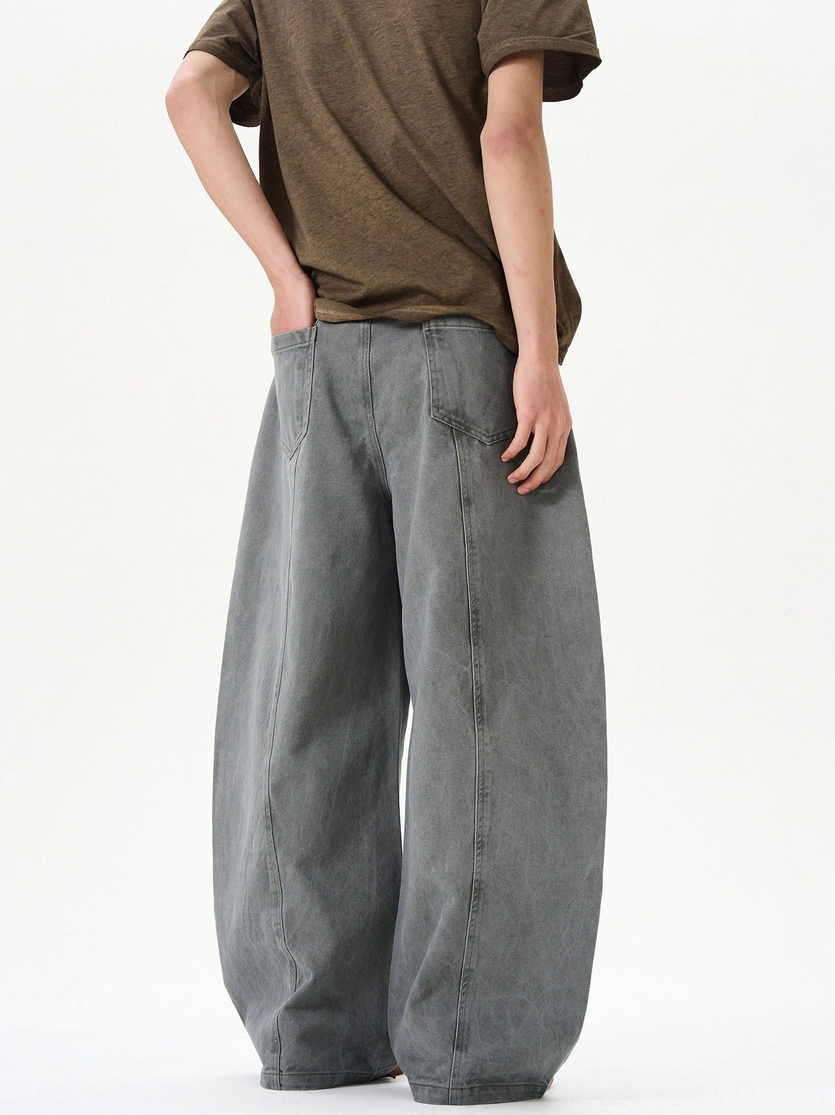 Bluish gray green washed denim ultra-wide jeans rear view showing oversized balloon leg and classic back pocket detail