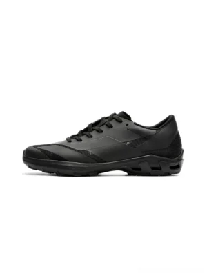 Side profile of an all-black arch-support low-profile sneaker with geometric panel details, lace-up closure, and textured anti-slip rubber outsole