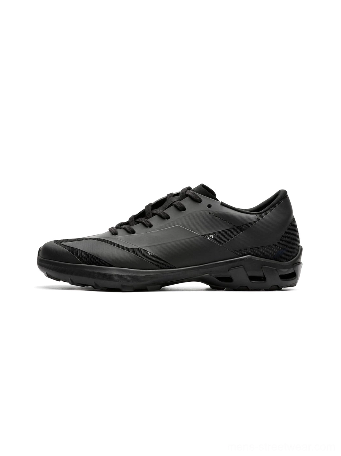 Side profile of an all-black arch-support low-profile sneaker with geometric panel details, lace-up closure, and textured anti-slip rubber outsole