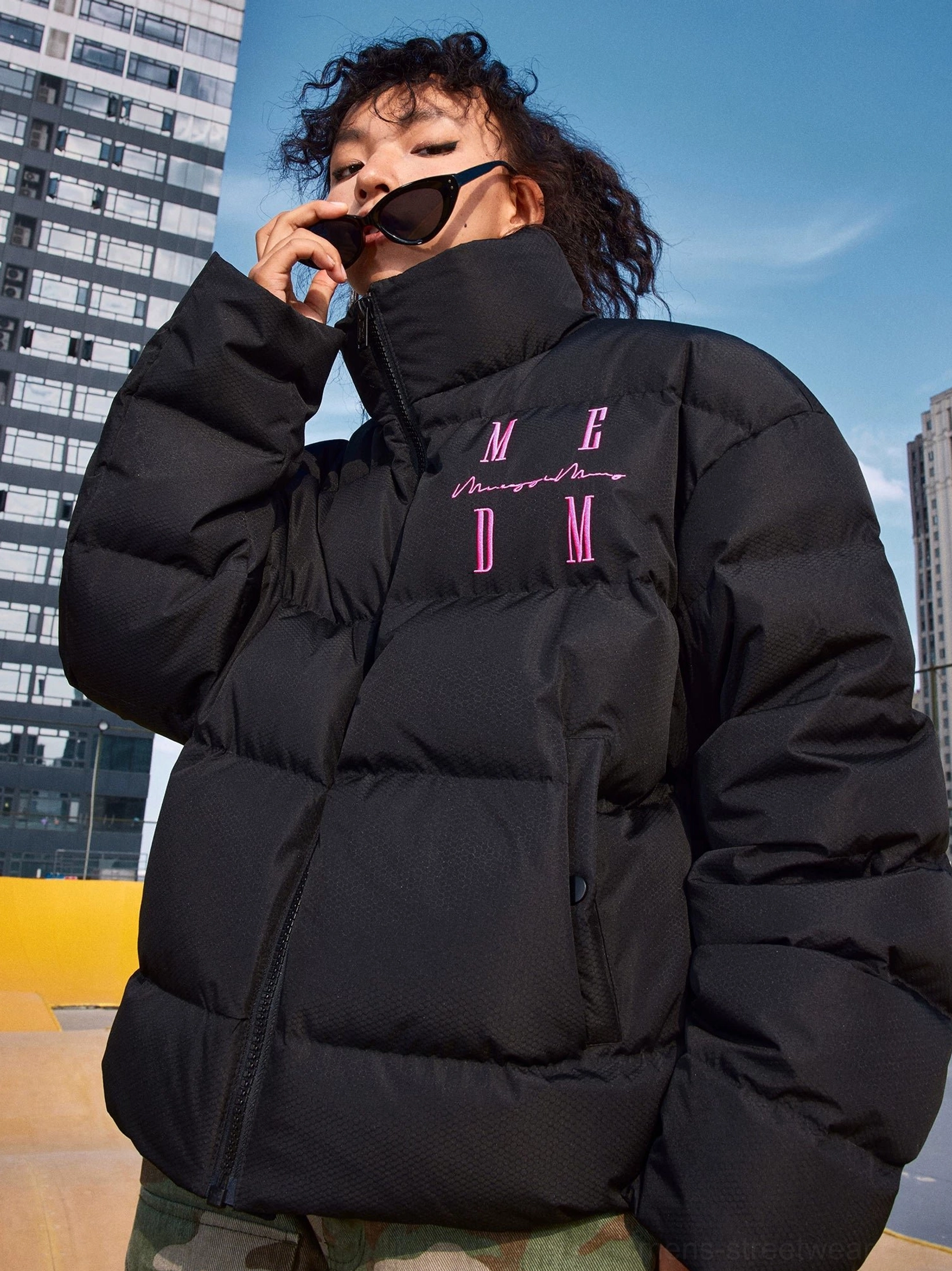 Black relaxed-fit duck-down puffer jacket with boxy quilted silhouette and high stand collar for urban streetwear