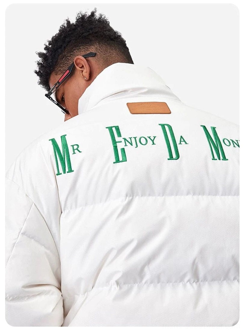 White oversized duck-down puffer jacket back close-up highlighting padded quilting and statement embroidered detail