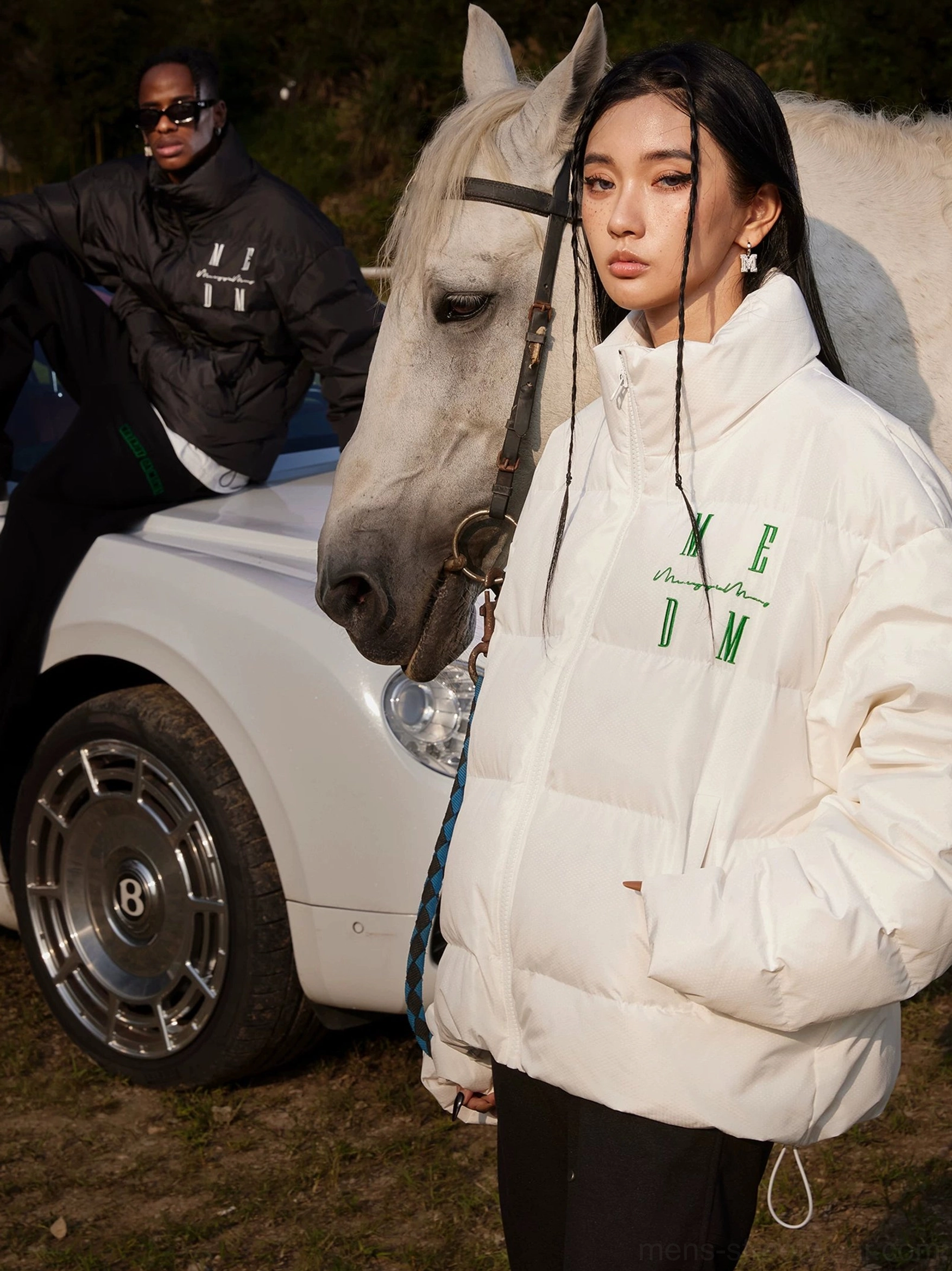 White oversized duck-down puffer jacket shown from the front with high collar side pockets and padded quilting