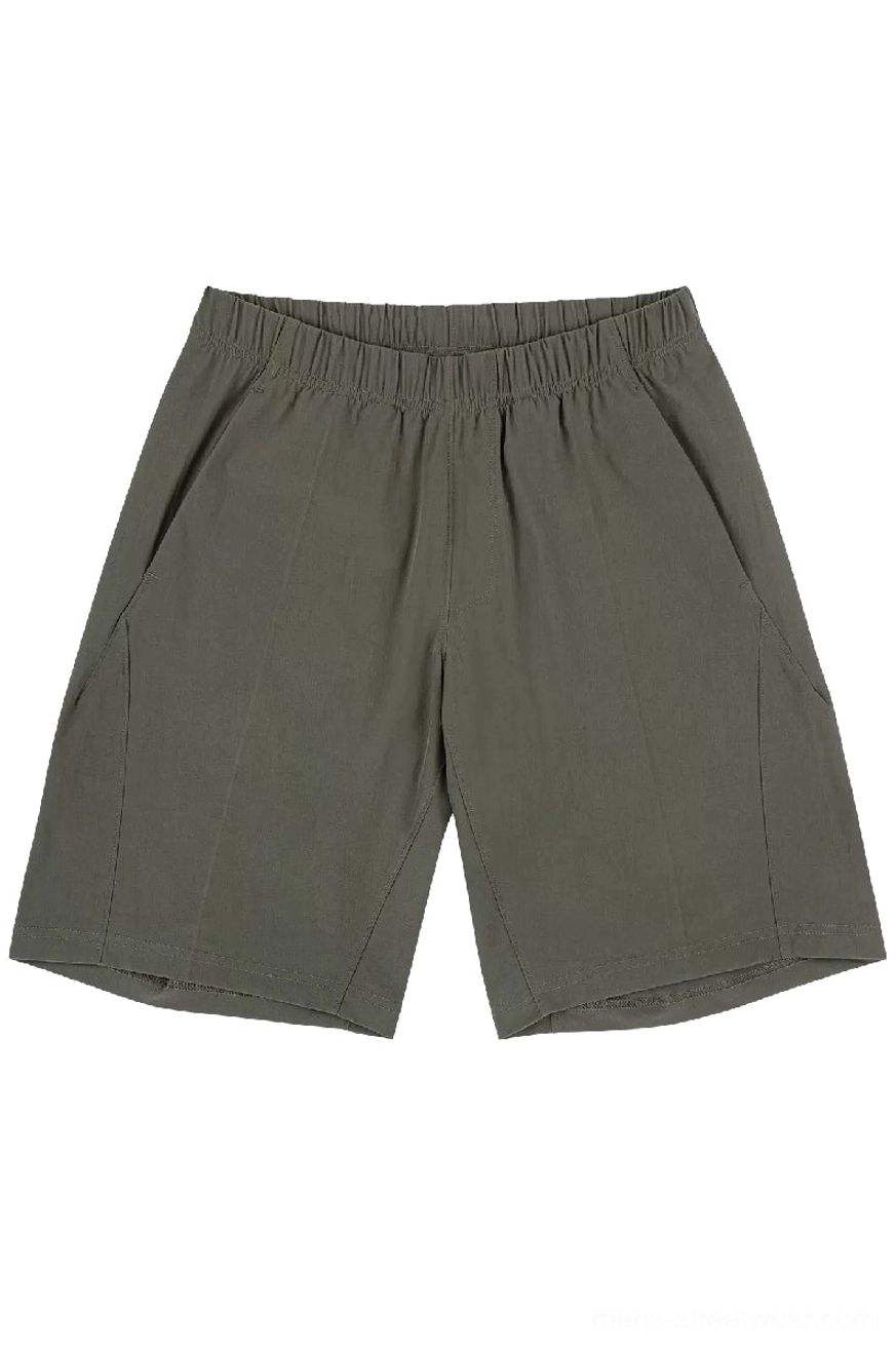 Army green above-knee quick-dry tech shorts front flat lay with relaxed streetwear silhouette