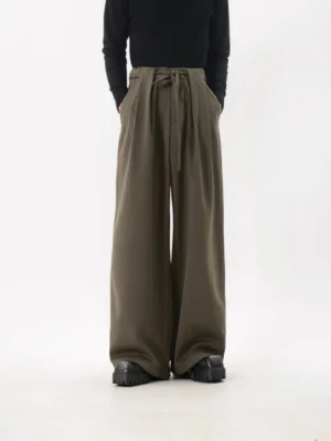 Army green high-rise wide-leg trousers showing the adjustable drawstring waist, tailored front pleats, and relaxed Korean streetwear fit