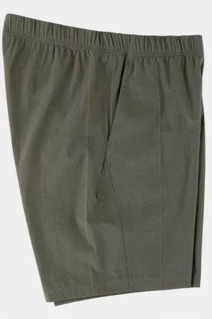 Army green oversized tech shorts side three-quarter flat lay showing relaxed straight leg and lightweight drape