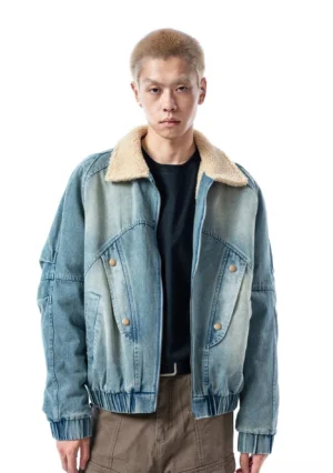 Ash blue sherpa collar denim bomber jacket front view showing faded wash flap pockets and elasticated hem