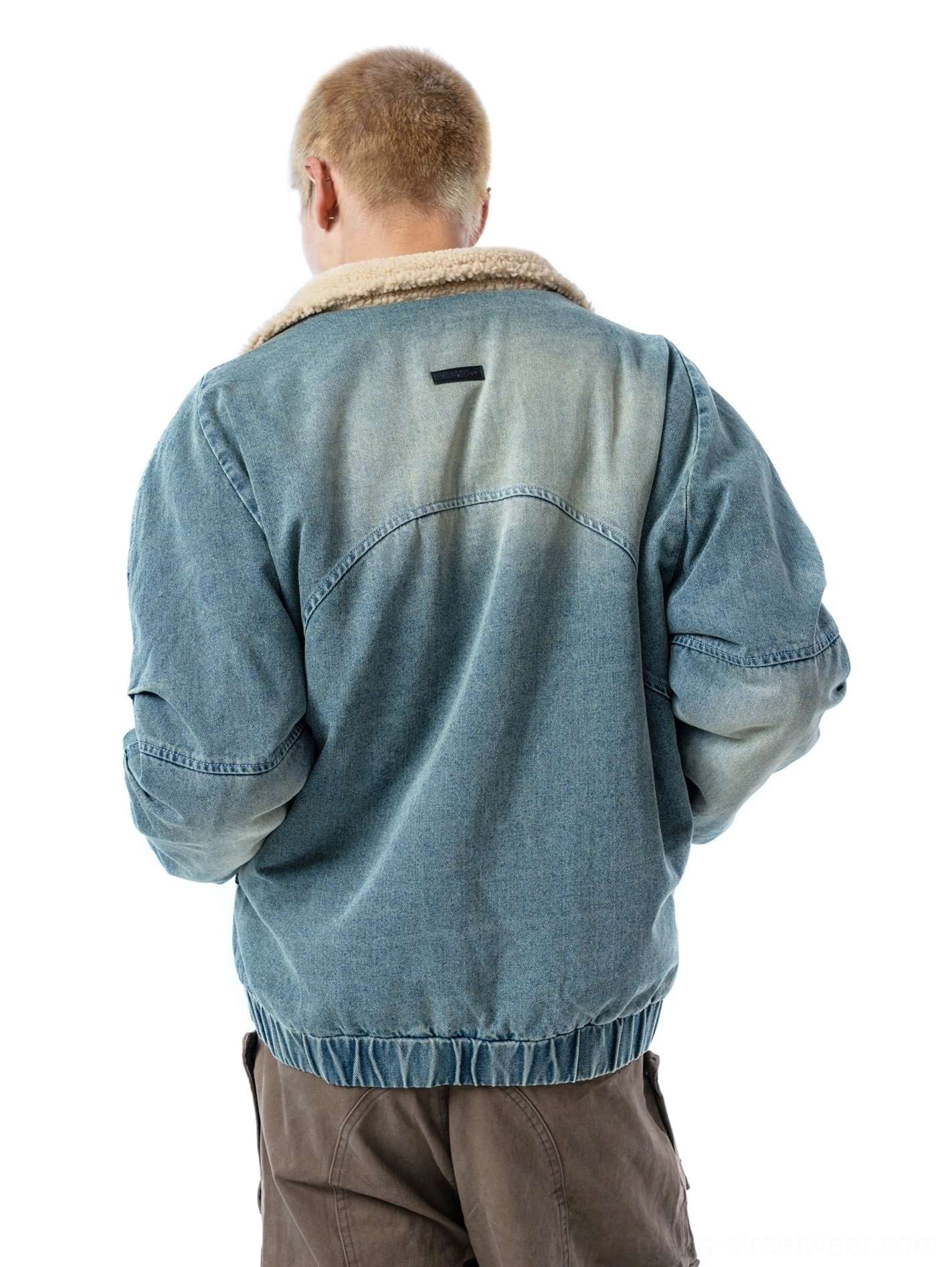 Ash blue washed denim bomber jacket back view with panelled yoke and elasticated ribbed waist hem