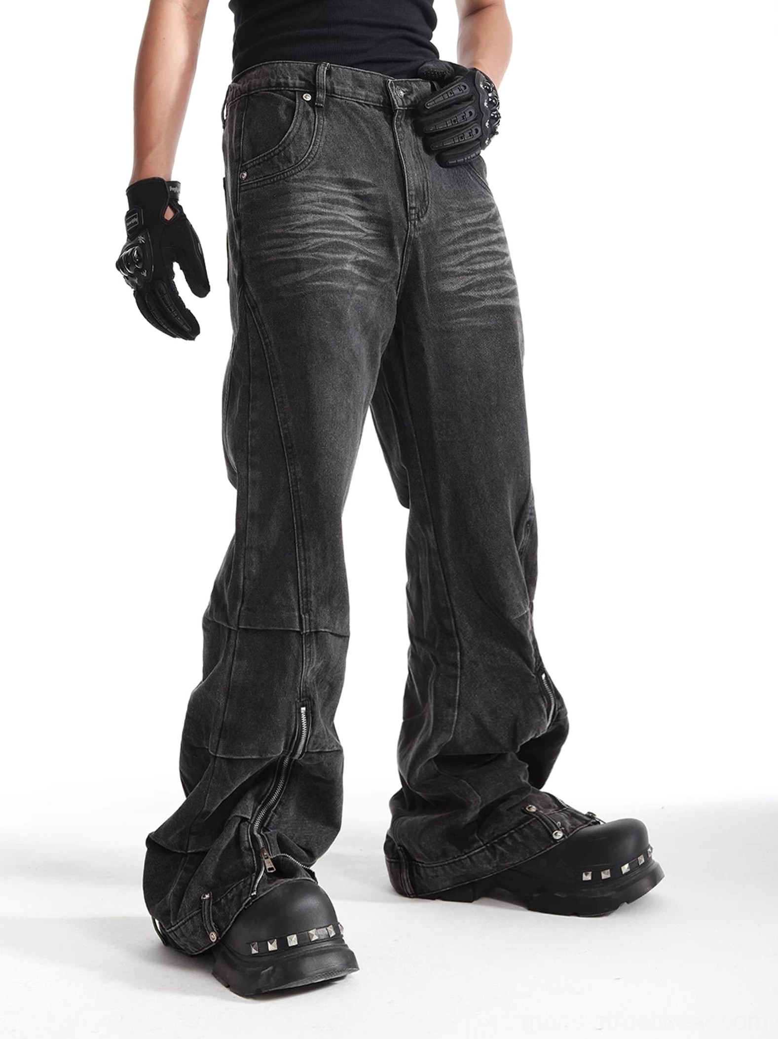Left side view of ash washed deconstructed streetwear jeans showing panel seams, loose wide leg fit, and ankle zipper detail