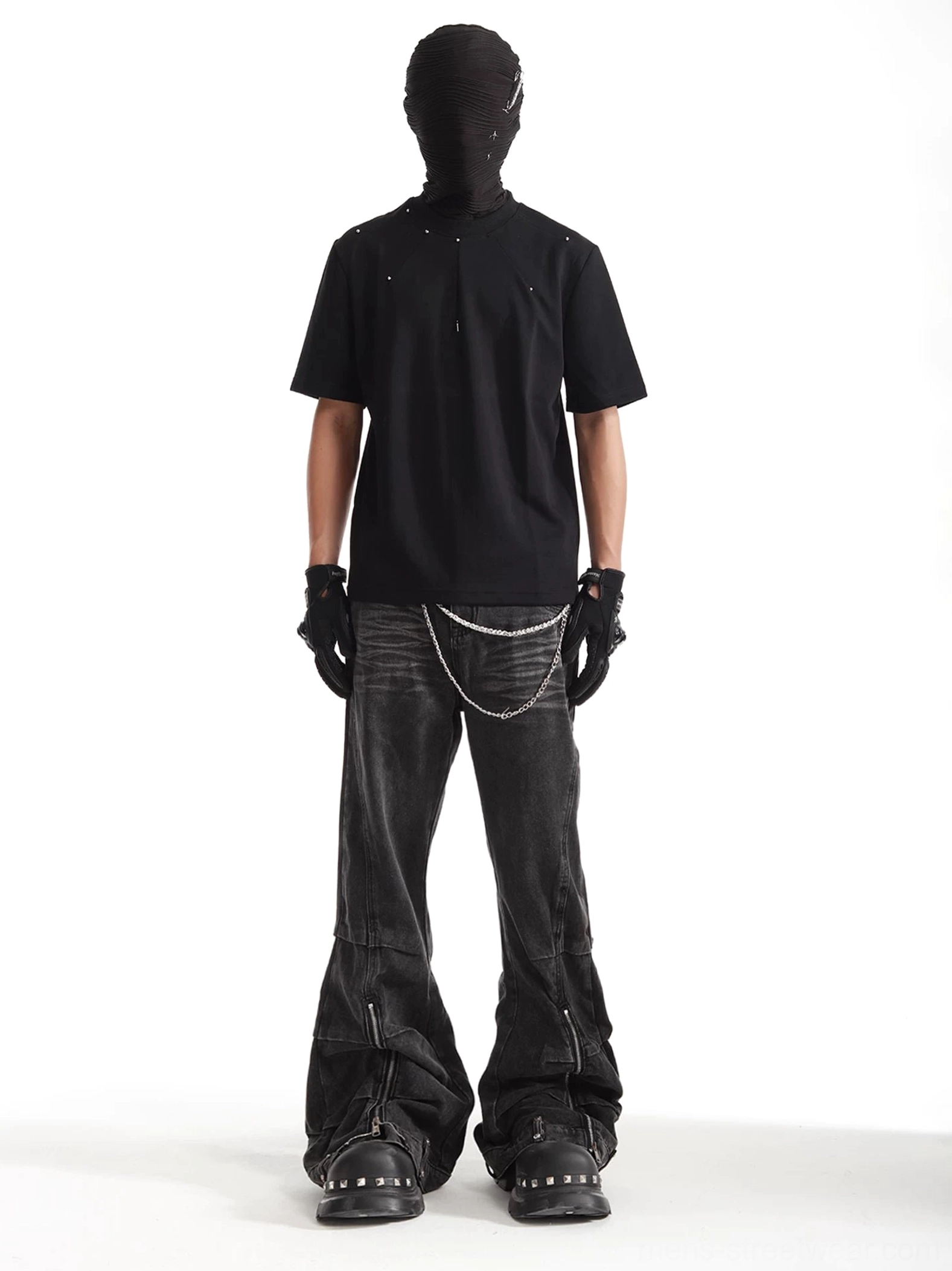 Rear view of ash washed wide leg deconstructed denim jeans styled with wallet chain, ankle zippers, and dark streetwear outfit