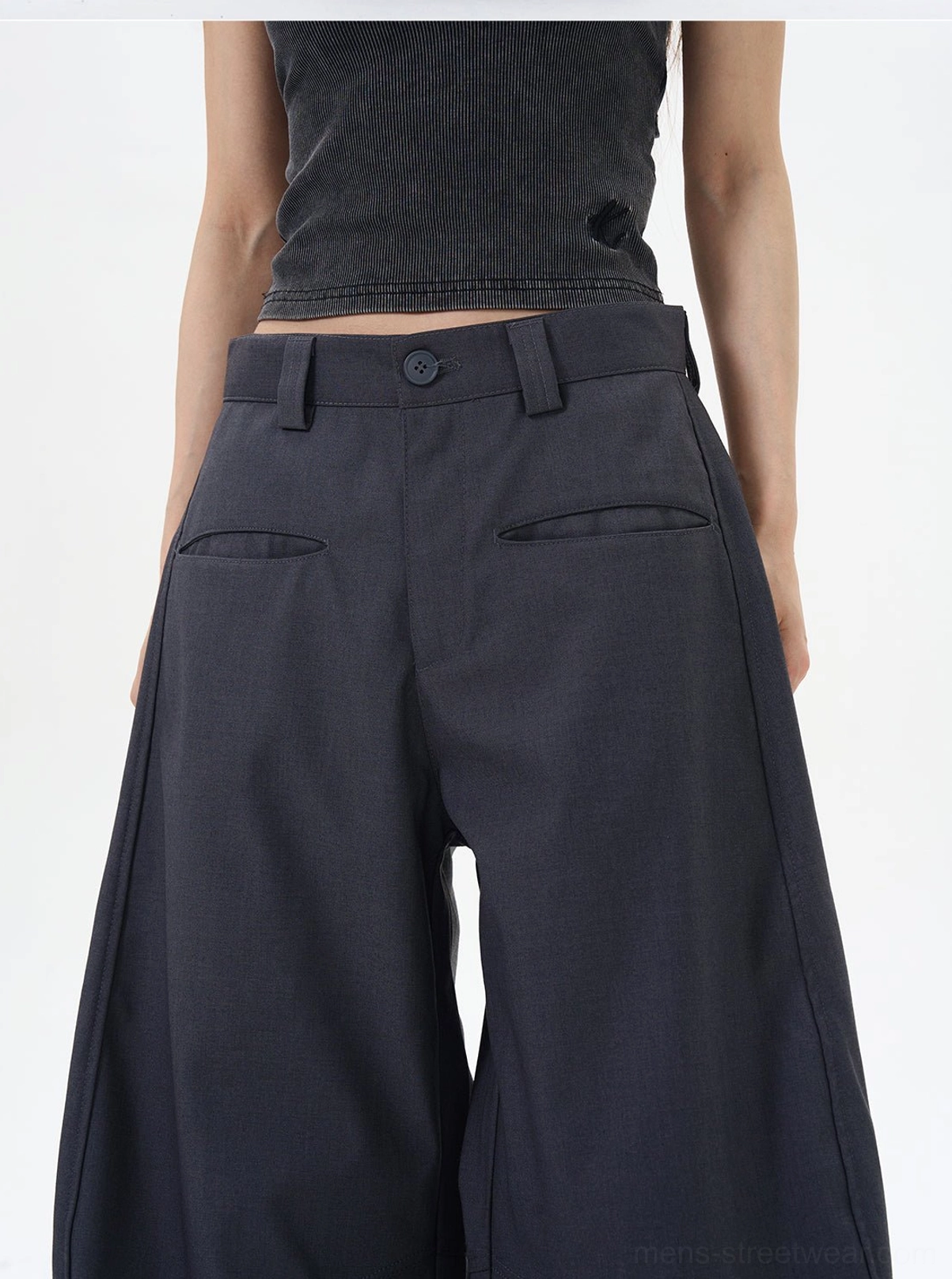 Close-up rear detail of ash wide-leg palazzo pants showing belt loops, buttoned waist closure, and structured back pockets