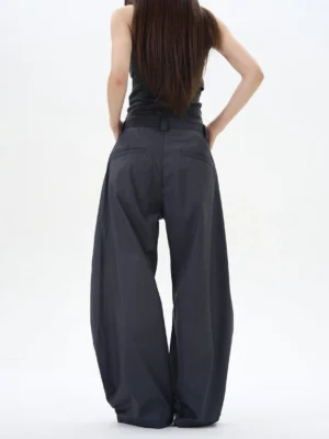Rear view of dark ash wide-leg palazzo trousers with tailored back pockets and a smooth high-waisted fit in modern Seoul-inspired style